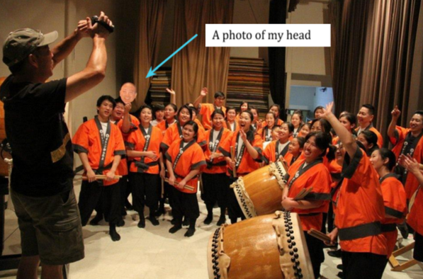 While I was deployed, Daion Taiko held a picture of my head to include me in the group photo at a performance.  They sent it to me to let me know they were thinking about me.